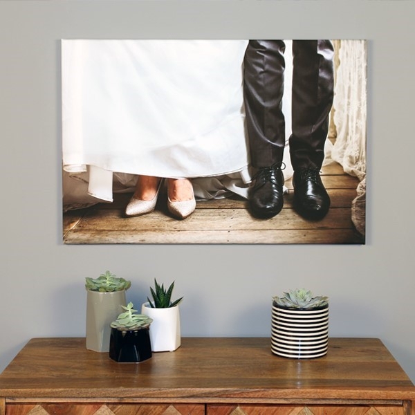 Canvas of wedding photos mounted at home