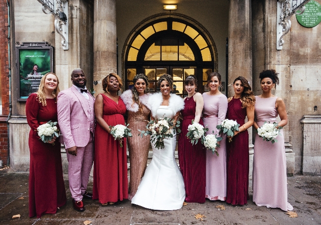 Bridal party poses with friends
