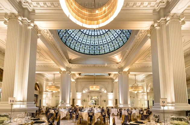 Wedding set up in ballroom of Andaz Hotel in London with columns and ivory decor