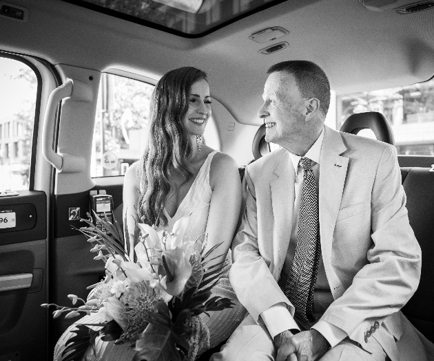 Bride and father in wedding car