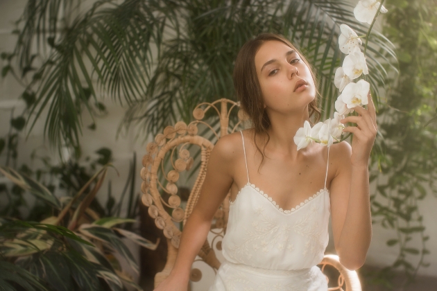 model in a wedding dress sitting down