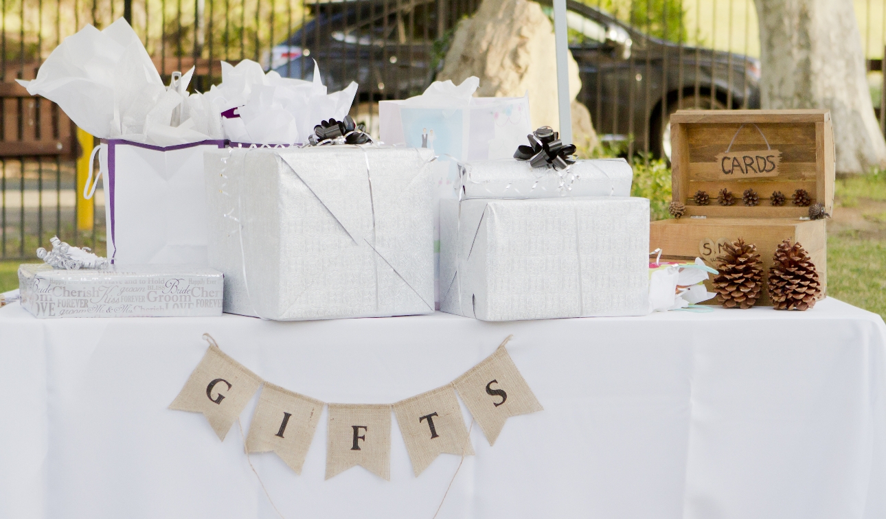 gift table with presents and a wooden box for cards