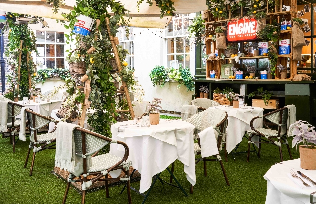 covered terrace area bistro-style with displays of flowers