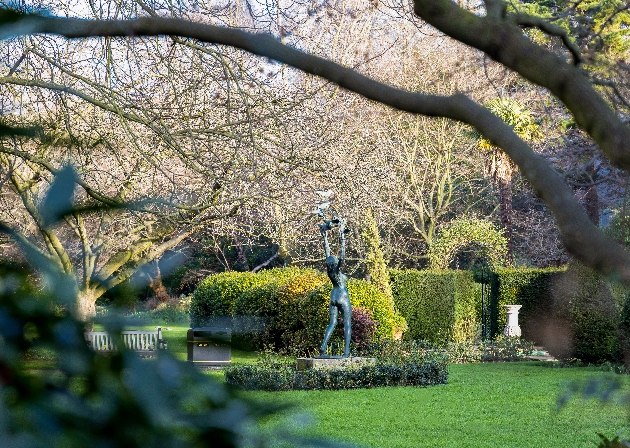 gardens with a statue in the centre of it 