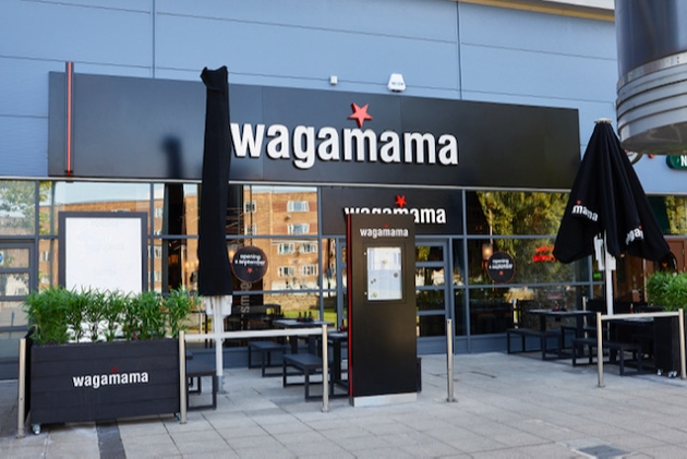 wagamama restaurant front with tables outside