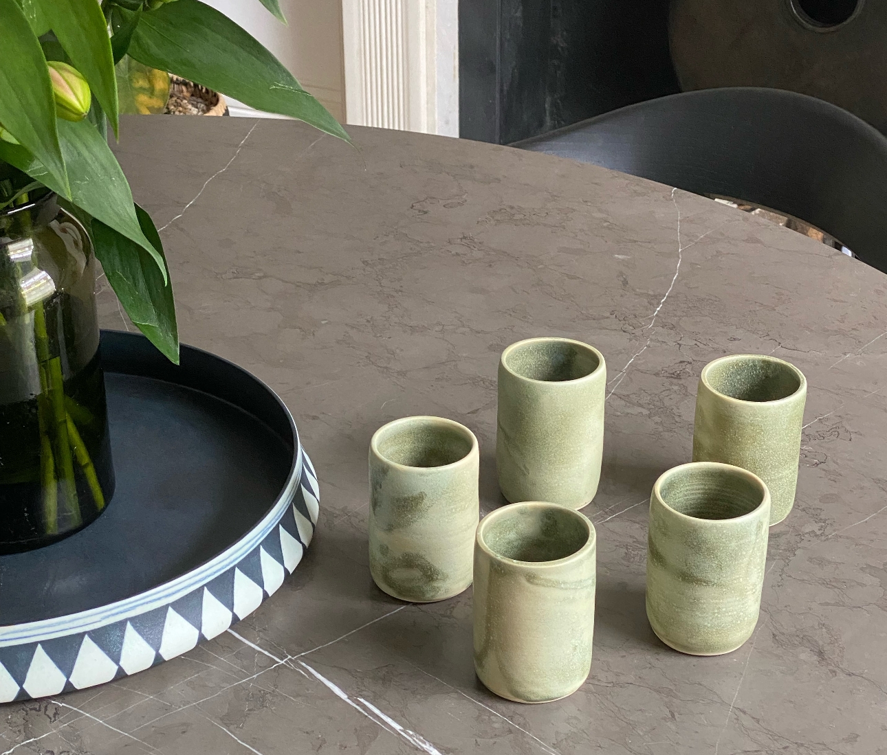clay bowls and tumblers in marbled pattern