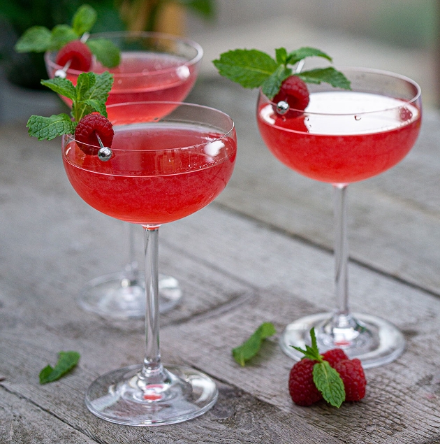 three babysham glasses of pink cocktail