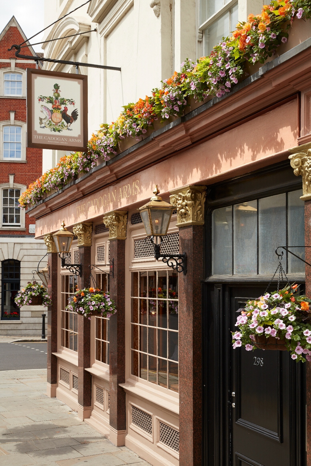 outside of The Cadogan Arms london pub on the street with flowers covering it