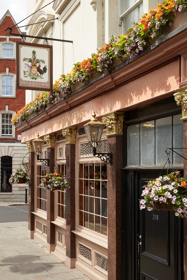 The Cadogan Arms exterior old pub front with lots of flowers