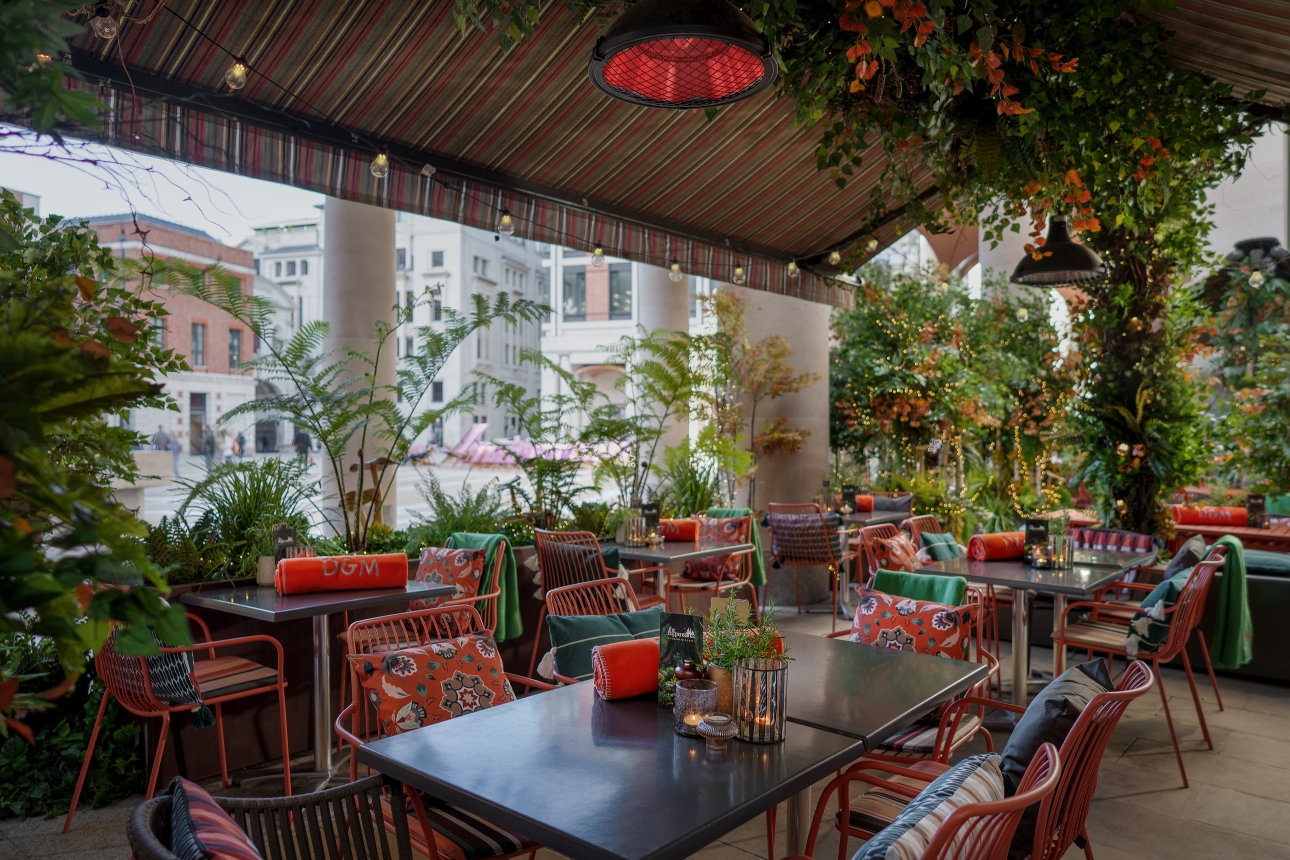 terrace with canopy, foliage, tables and chairs, london street