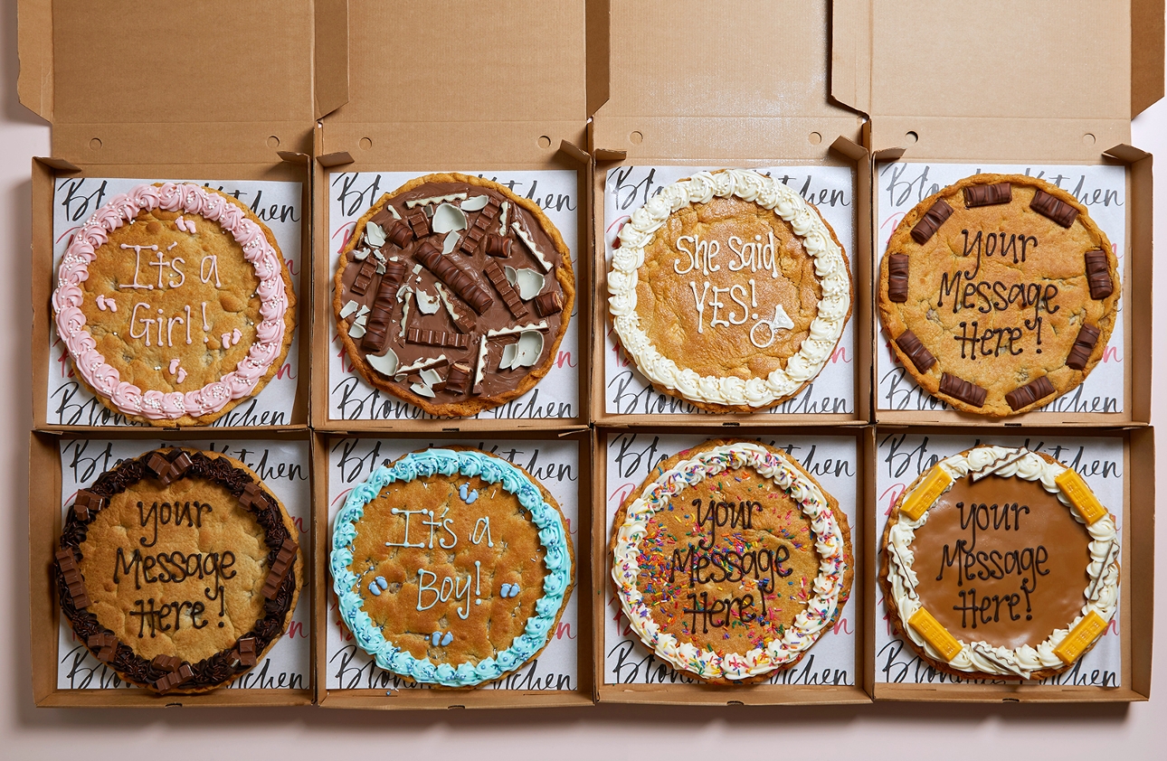 range of cookies in boxes with different greetings on