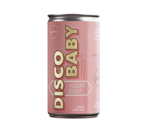 cocktail in can with pink and gold label