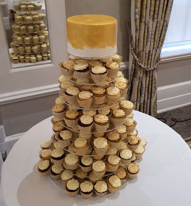 cupcake tower with golden tier on top