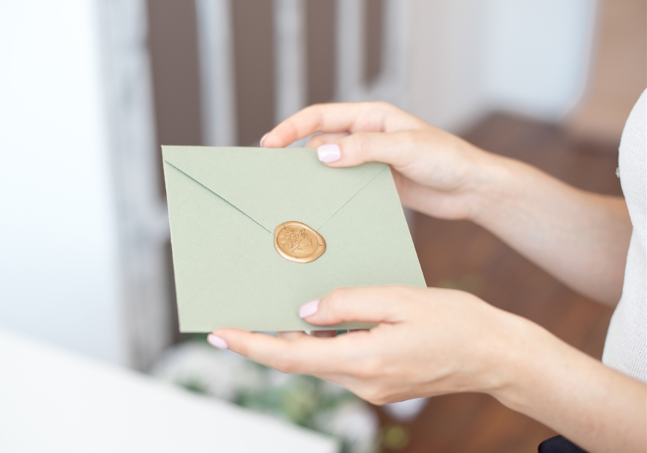 green gift envelope in someone's hands