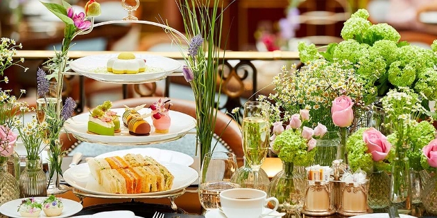 afternoon tea on a table with lots of floral decor elements