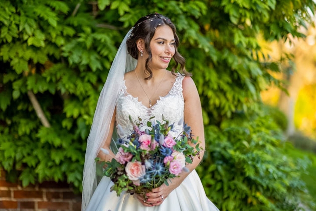 bride holding colourful bouquet