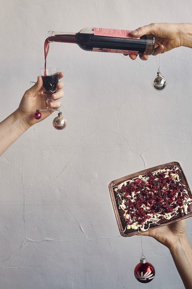 Hands pouring drink & holding black forest brownie