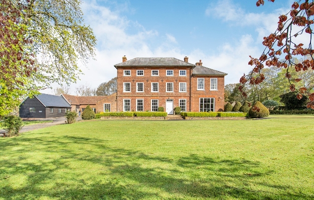 Sandon Manor, red brick country house with large lawn