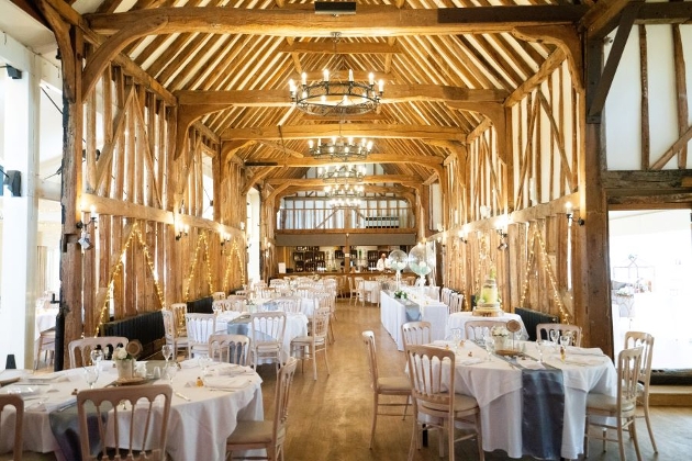 barn style venue with table set up for a reception