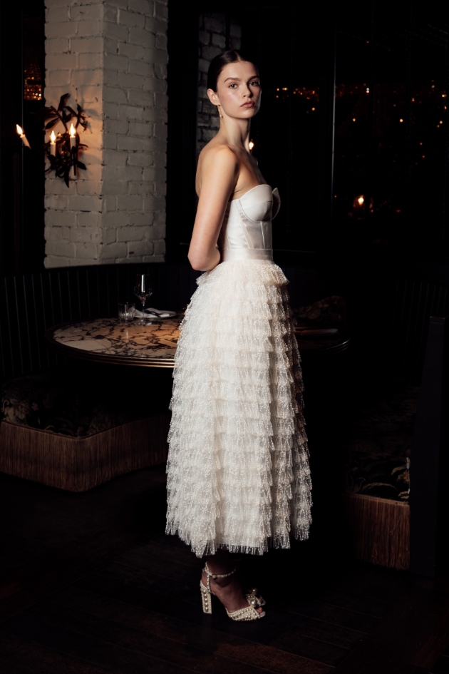 woman in ruffle white dress