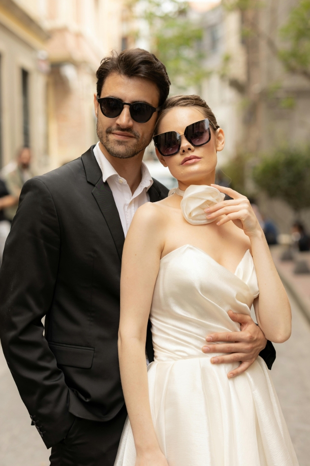 bride and groom posing in sunglasses