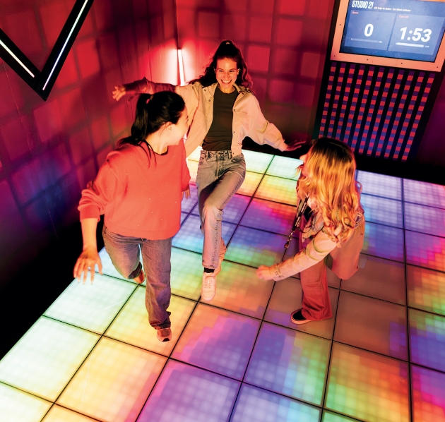 players taking on interactive challenge rooms at prison island london